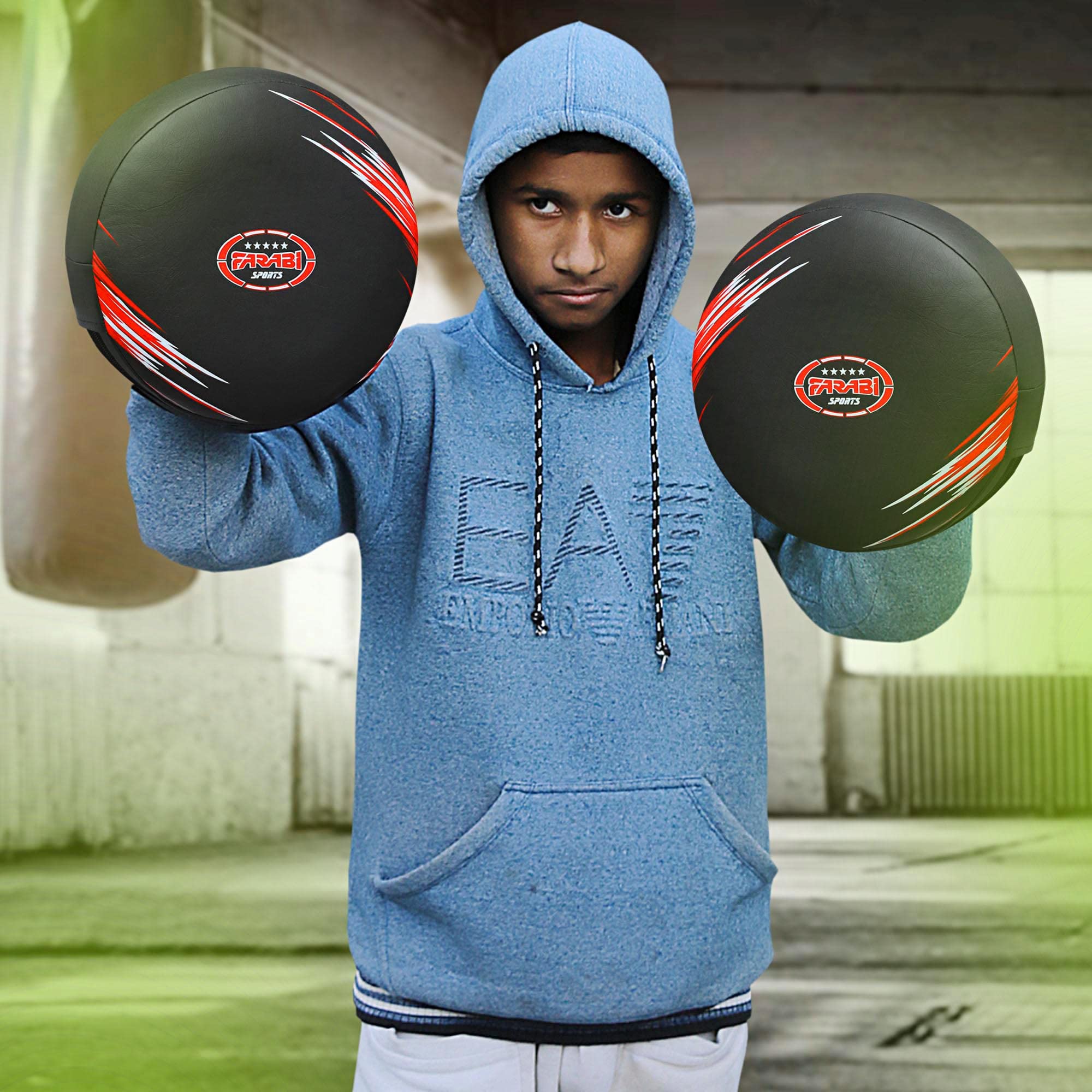 Farabi Sports boxing focus mitt training session featuring a fighter practicing with bold black and red mitts.
